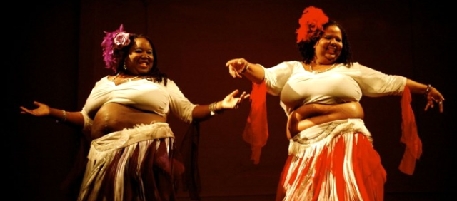 two fat black women bellydancing