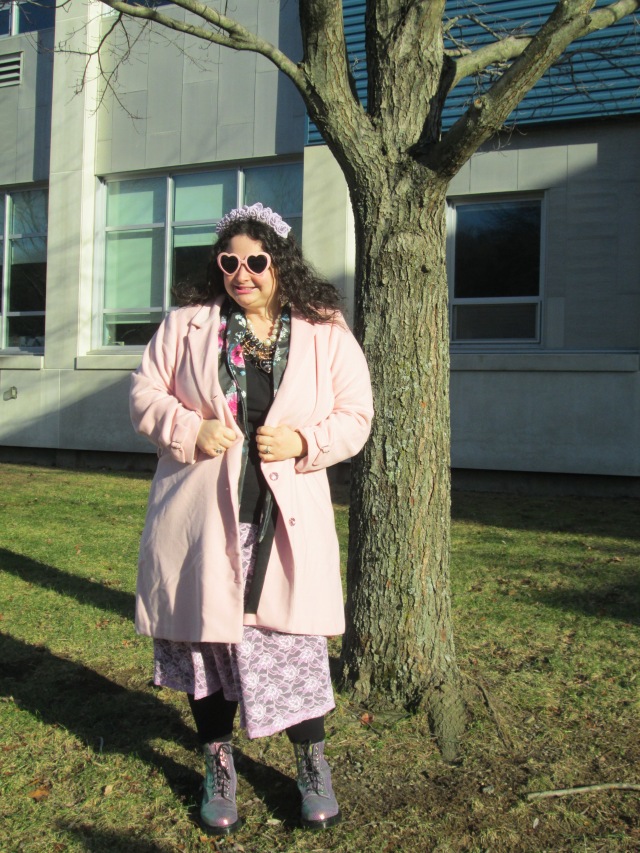 plus size outfit with pink coat, lace skirt, black top, floral blazer, pink heart-shaped sunglasses
