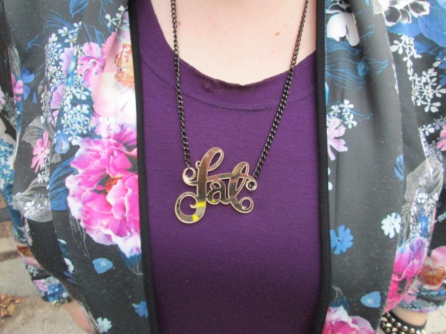 close-up of gold mirrored "fat" necklace