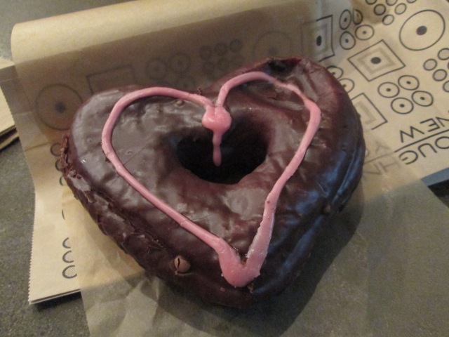 heart-shaped donut with chocolate and pink frosting
