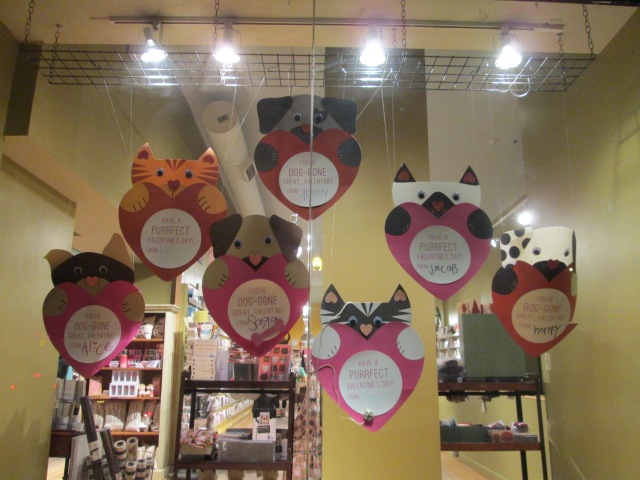 puppy and kitty valentines hanging in store window