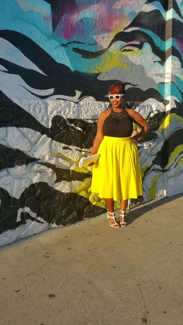 plus size outfit black top and yellow midi skirt